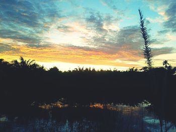 Scenic view of landscape against cloudy sky