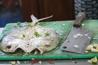Close-up of dead fish on table