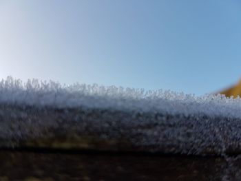 Scenic view of water against clear sky