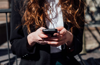 Close-up of woman using mobile phone