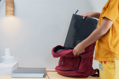 Midsection of man holding hands