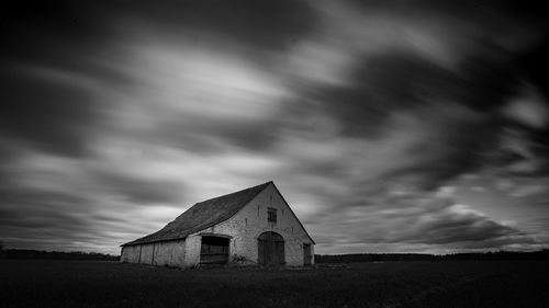 House on field against sky