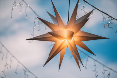 Low angle view of christmas decorations against sky