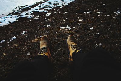 Low section of man standing on floor