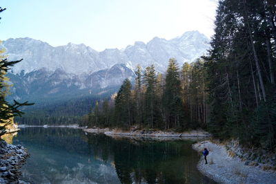 Scenic view of lake and mountains against sky