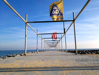 Lifeguard hut on beach against clear sky