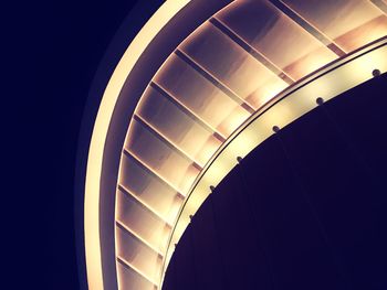 Low angle view of illuminated building against sky at night