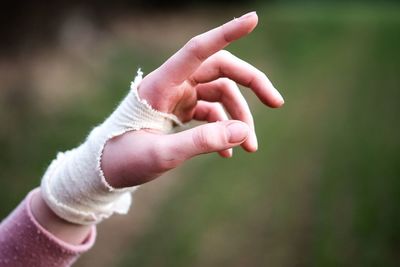 Close-up of woman hand with bandage
