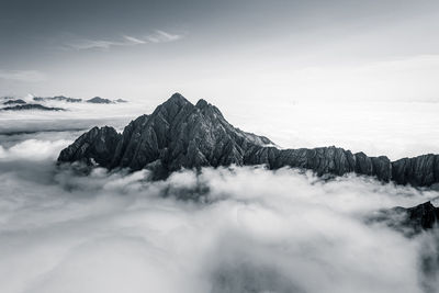 Mountain peaks rising above a sea of clouds, lienz, austria.