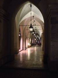 Empty corridor of illuminated building