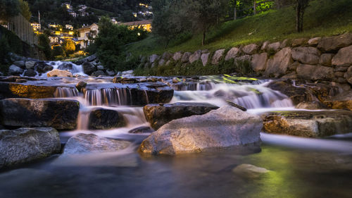 Scenic view of waterfall against sky