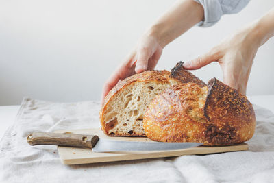 Cropped hand of person preparing food