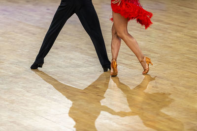 Low section of woman dancing on floor