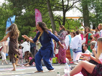 People sitting in traditional clothing