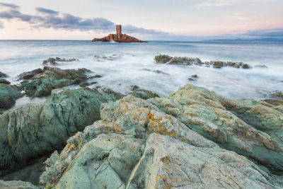 L'île d'or with its tower in front of the dramont beach in saint-raphaël