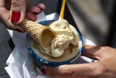 Midsection of person holding ice cream