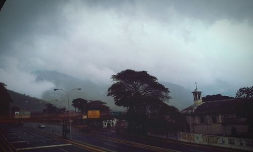 View of buildings against cloudy sky