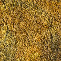 Full frame background and texture of decorative plaster on outside wall of the building