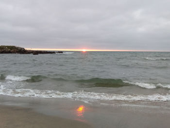 Scenic view of sea against sky during sunset