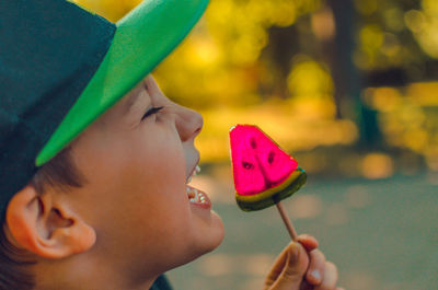 Close-up of boy holding food