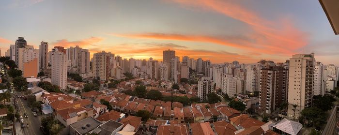 High angle view of buildings against sky during sunset