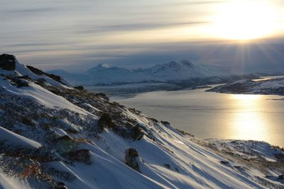 Scenic view of snow mountains against sky during sunset