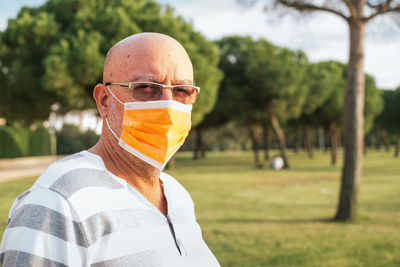 Portrait of 65-year-old man with surgical mask