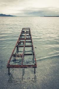 Pier on sea against sky