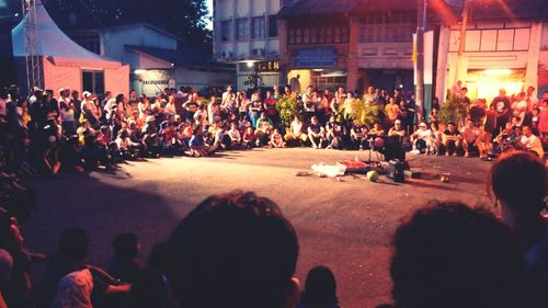 High angle view of people standing on city street