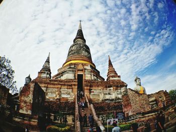 Low angle view of cathedral against cloudy sky