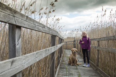 Girl with dog outdoors