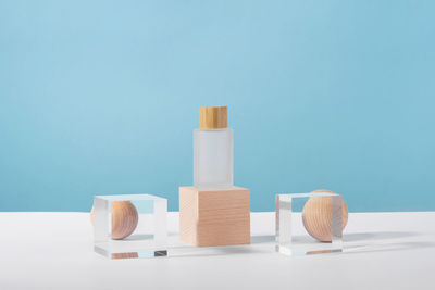 Medical skincare and cosmetic cream mockup on wooden block pedestal podium with stylish props