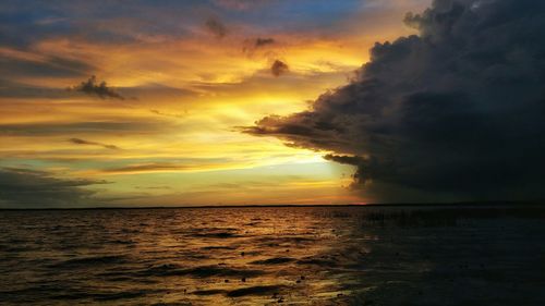 Scenic view of sea at sunset