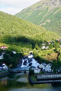 Scenic view of river by mountains