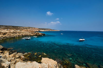 Boats sailing on sea