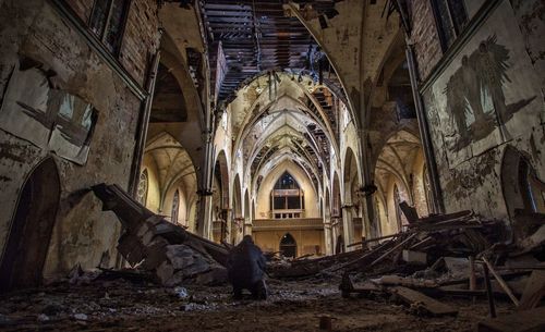 Rear view of person in abandoned church