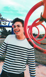 Portrait of smiling young man standing outdoors