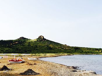 Scenic view of calm sea against clear sky