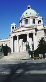 Low angle view of church against clear blue sky