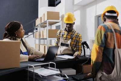 Rear view of man working in office