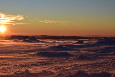 Scenic view of beach against sky during sunset