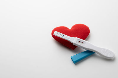 Close-up of heart shape over white background