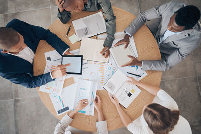 High angle view of business colleagues playing chess