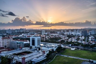 High angle view of buildings against sky during sunset