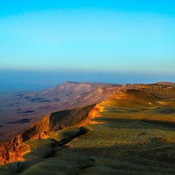 Scenic view of land against clear blue sky