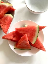 High angle view of chopped fruits in plate on table