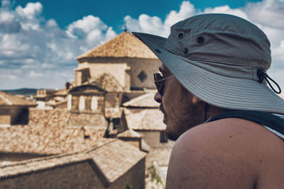 Rear view of tourist wearing hat