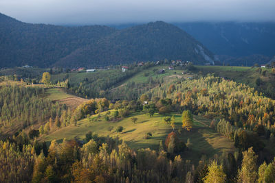 Scenic view of landscape and mountains against sky