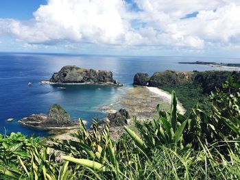 Scenic view of sea against cloudy sky