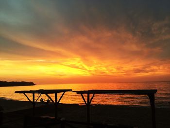 Scenic view of sea against orange sky